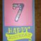 Shaker-card in lilla con numero e palloncini per 7° compleanno
